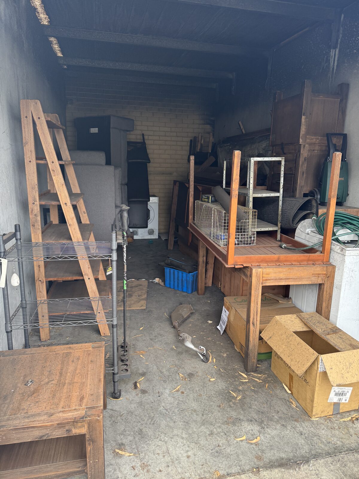 Storage unit clear-out — furniture and household items being removed